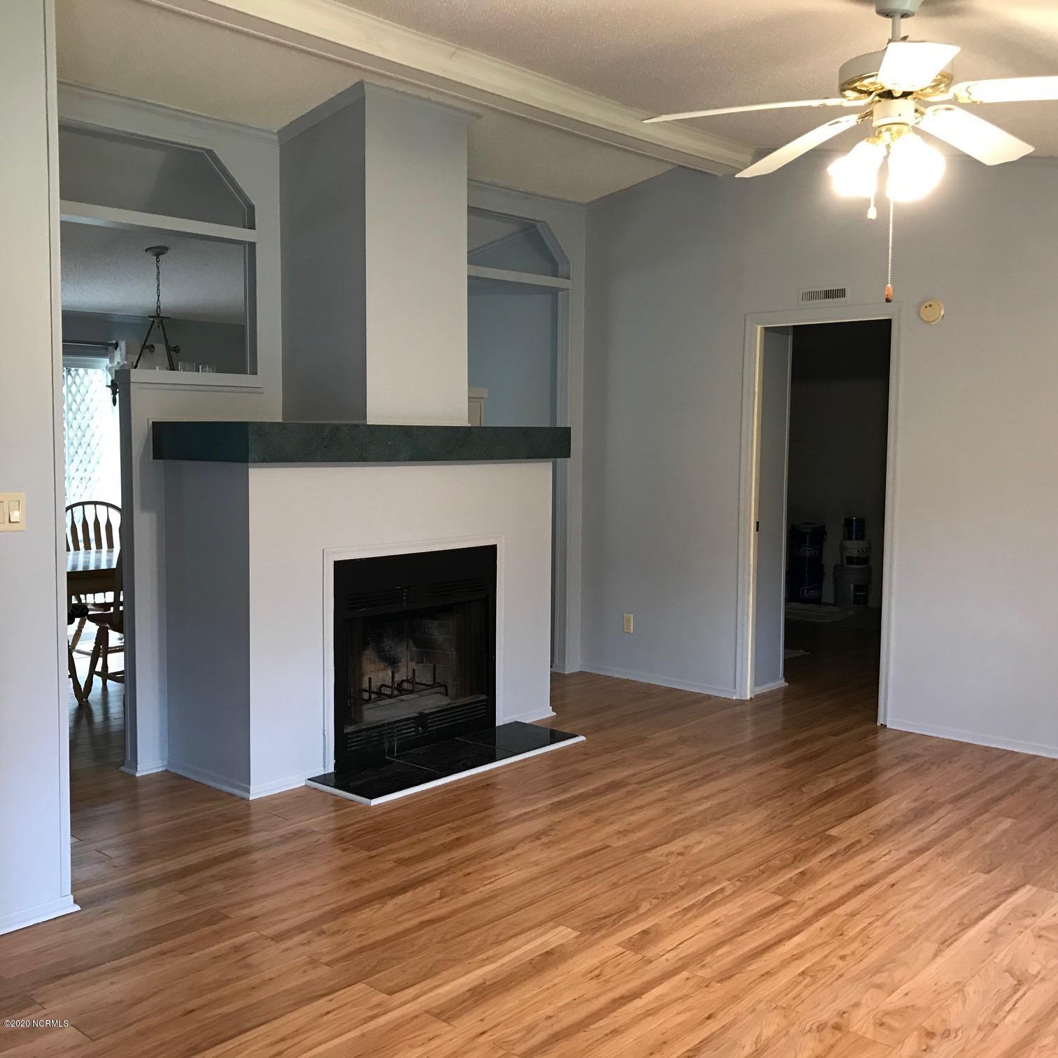 1340 Sloop Point Road Hampstead, NC 28443 - Photo 8 of 17 Bright and Cheery Living Room, with fireplace