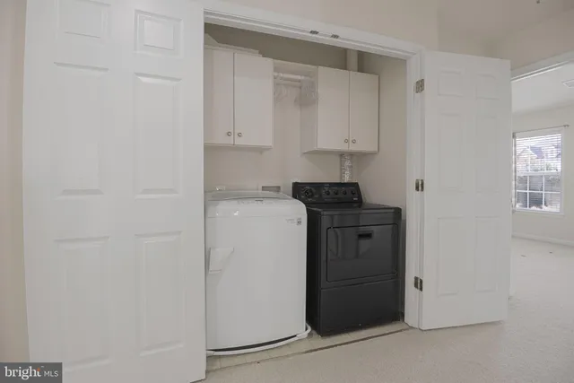 a kitchen with a stove and a refrigerator