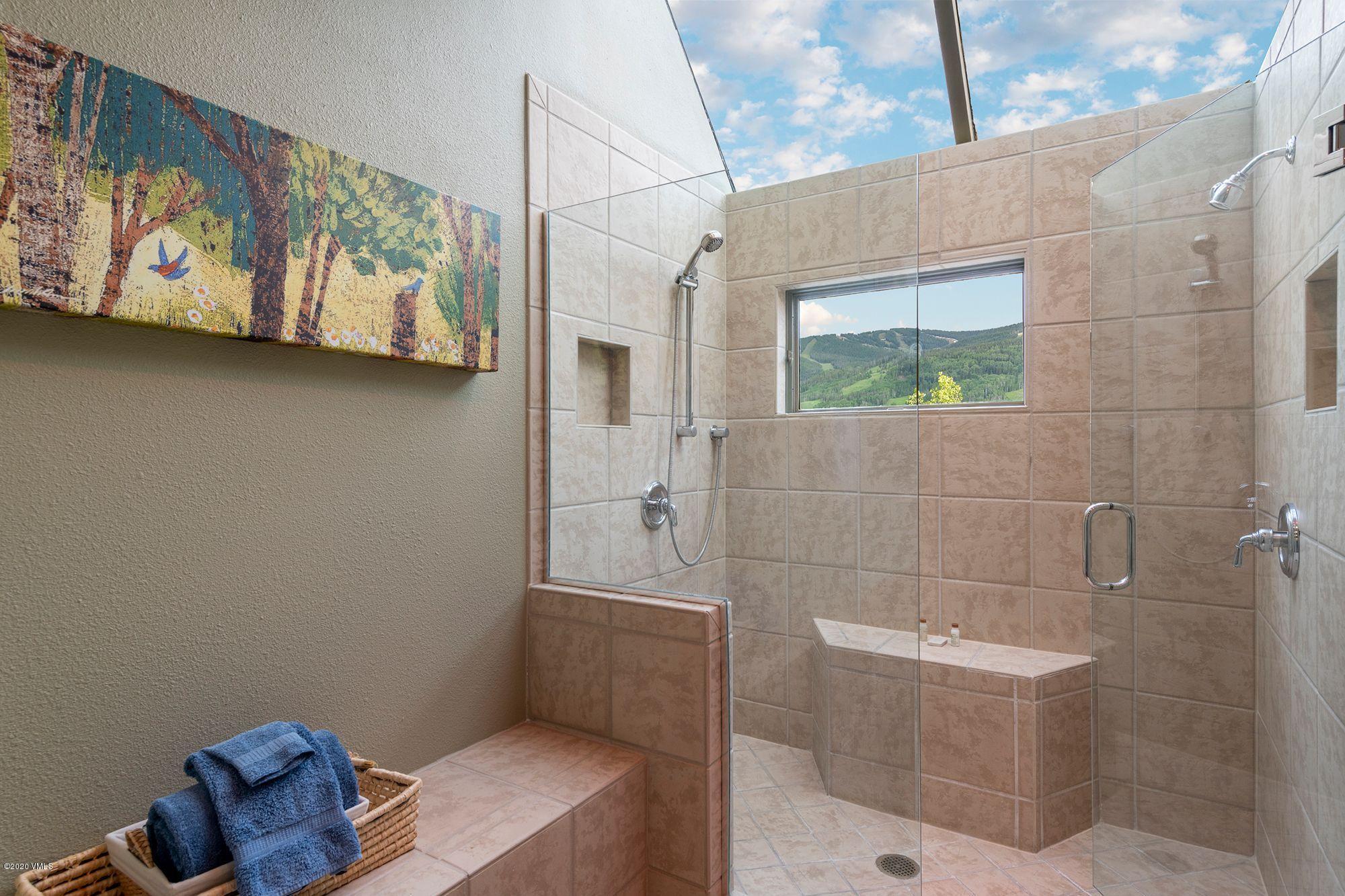 770 Potato Patch Drive, Unit 15 Vail, CO 81657 - Photo 13 of 23 a bathroom with a bathtub and shower