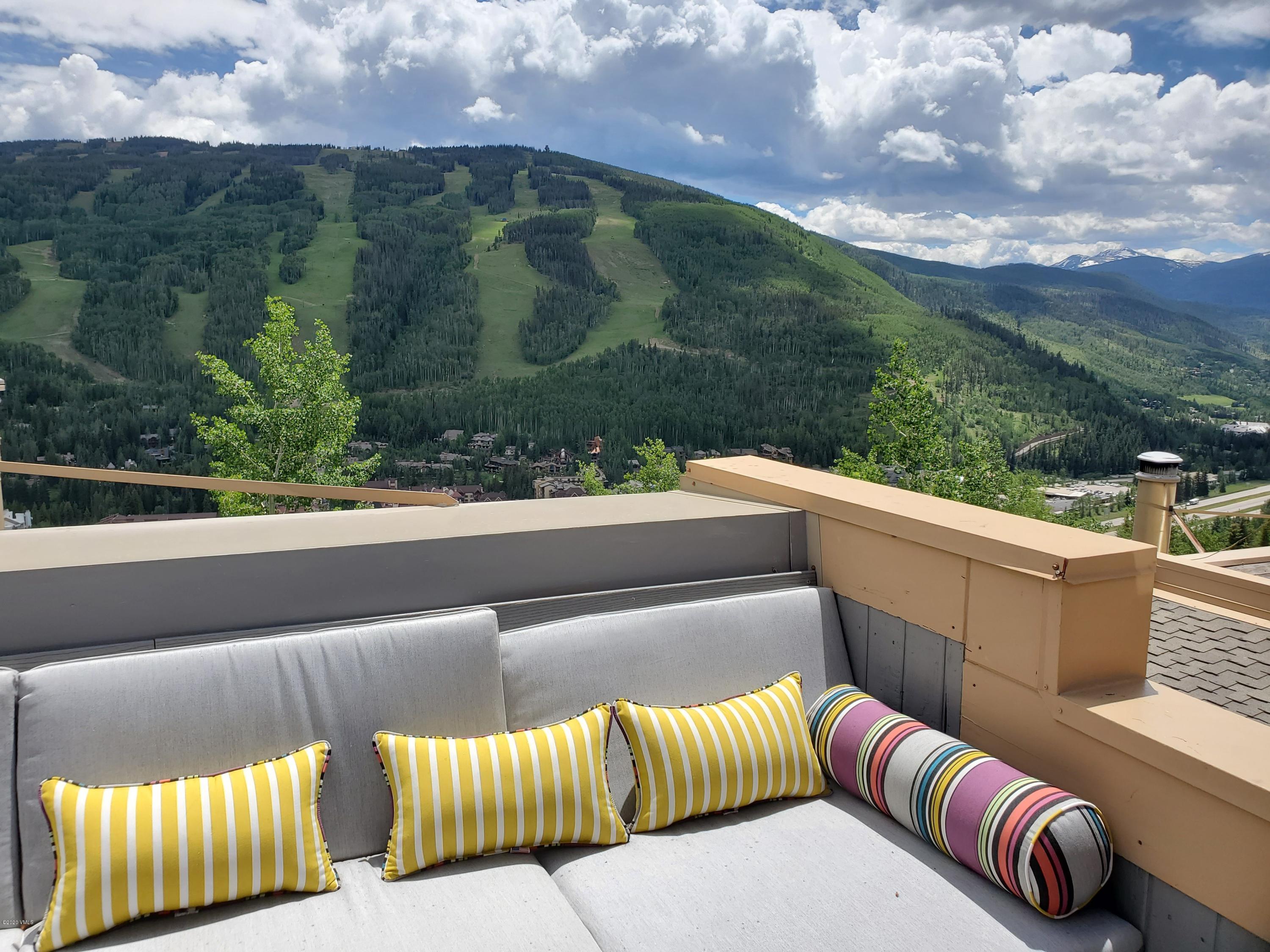 770 Potato Patch Drive, Unit 15 Vail, CO 81657 - Photo 17 of 23 a view of a roof deck with couches and sky view
