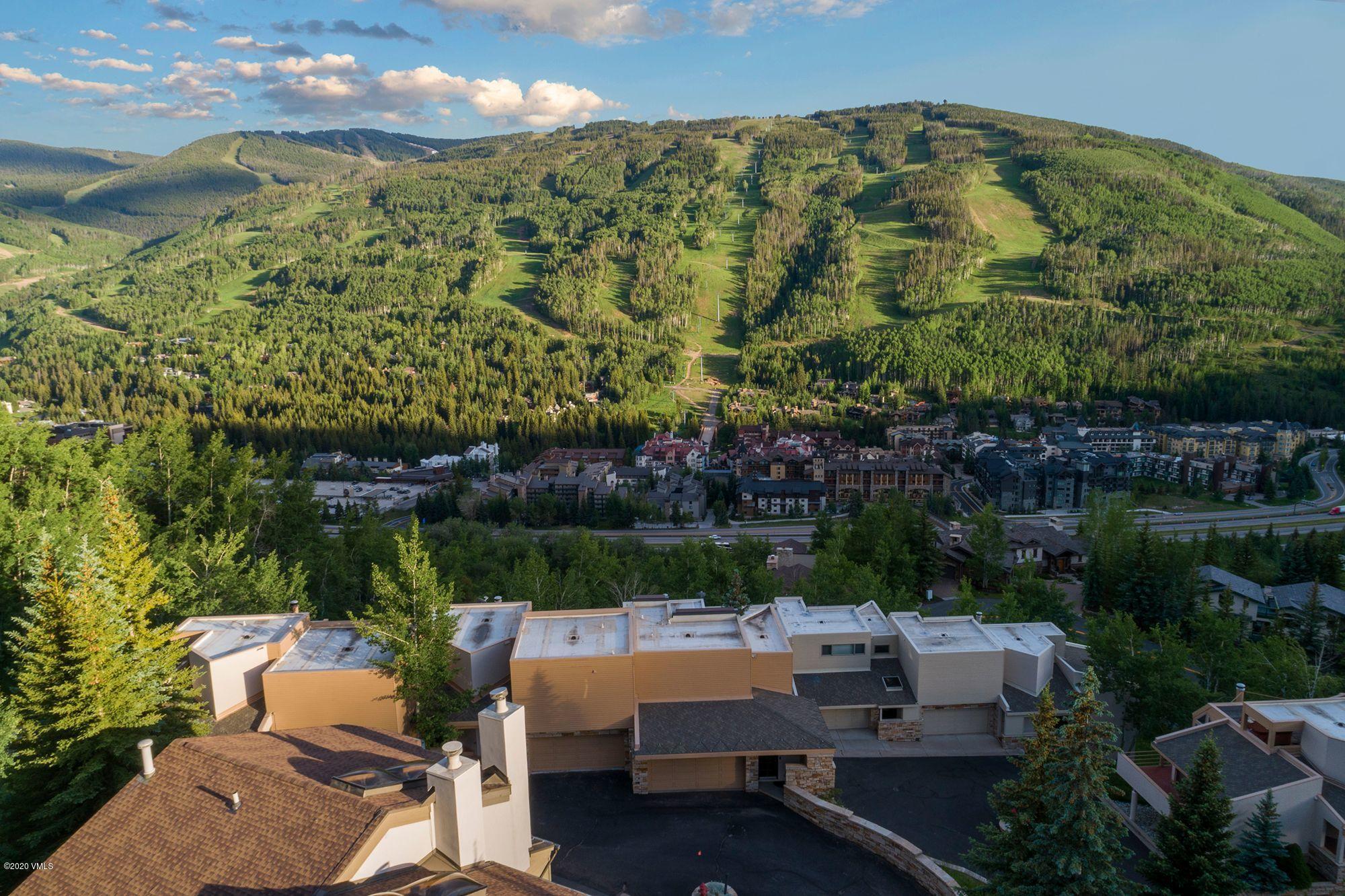 770 Potato Patch Drive, Unit 15 Vail, CO 81657 - Photo 22 of 23 a backyard of a house with outdoor seating