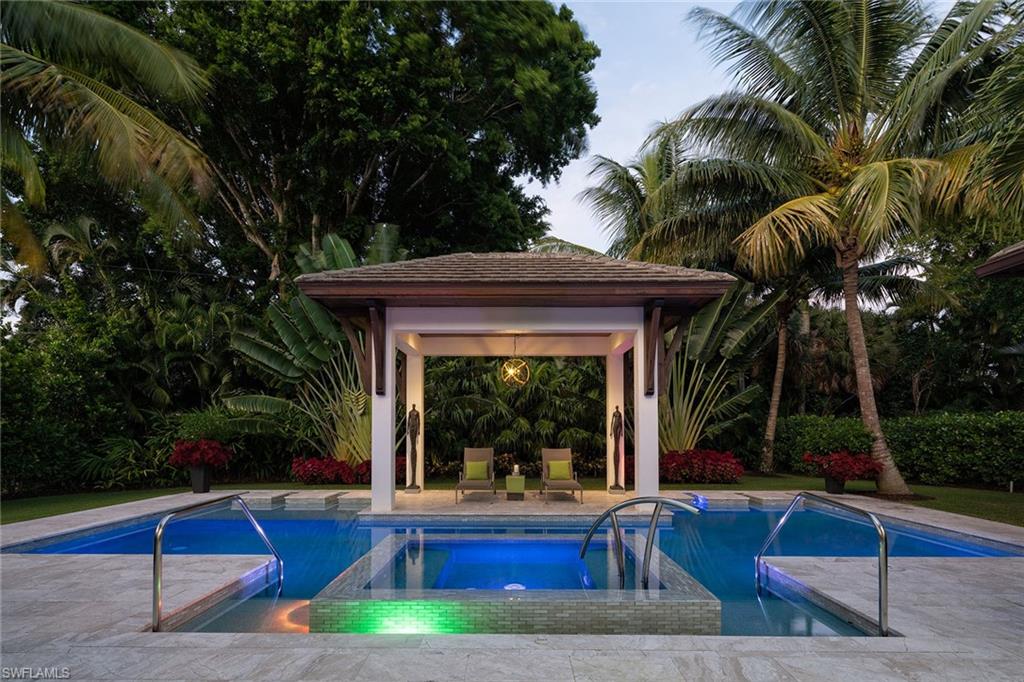 453 Spinnaker Drive Naples, FL 34102 - Photo 13 of 14 a view of swimming pool with outdoor seating and yard