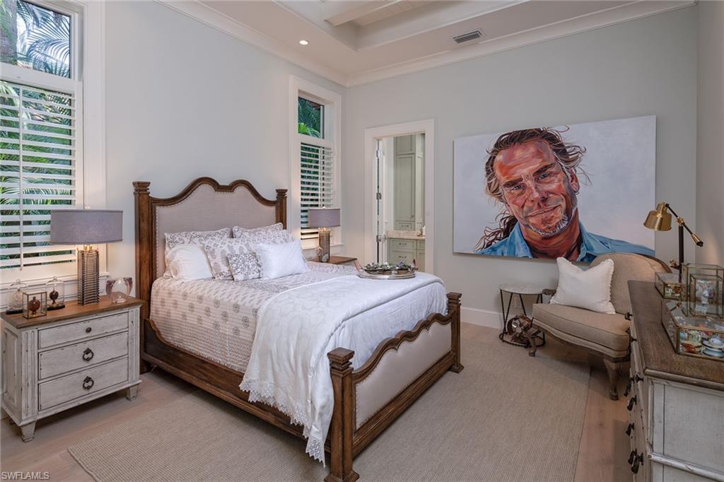 453 Spinnaker Drive Naples, FL 34102 - Photo 7 of 14 a bedroom with a bed and a couch