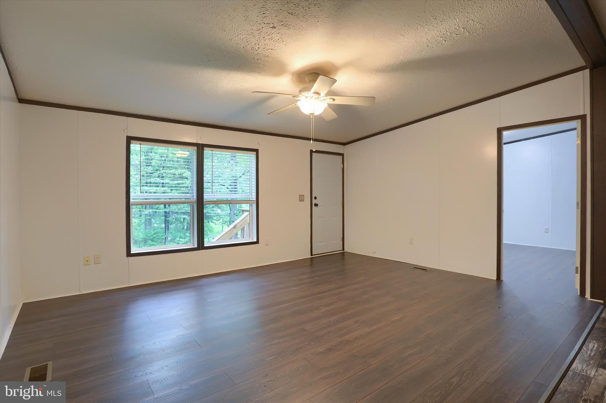 1148 Moulstown Road North Hanover, PA 17331 - Photo 6 of 29 a view of an empty room with wooden floor and a window