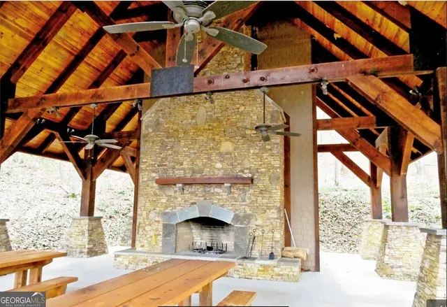 a living room with a fireplace a couch and a fireplace