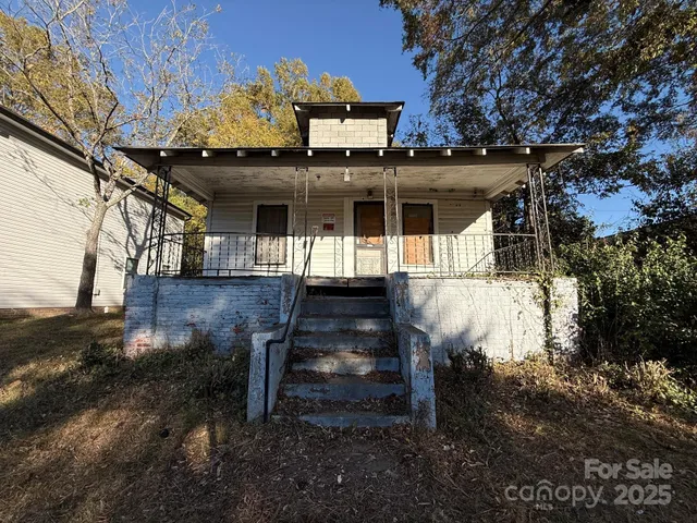 a view of a house with large windows