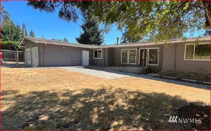 16623 Southeast 112th Street Renton, WA 98059 - Photo 1 of 1 a house with trees in the background