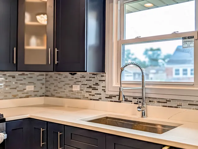 a kitchen with a sink and a window