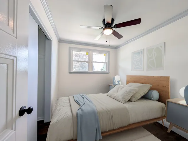 a bedroom with a bed furniture and a window