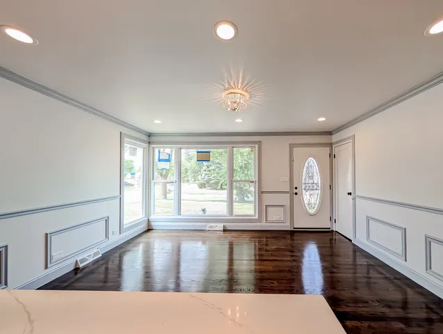 a view of an entryway with wooden floor