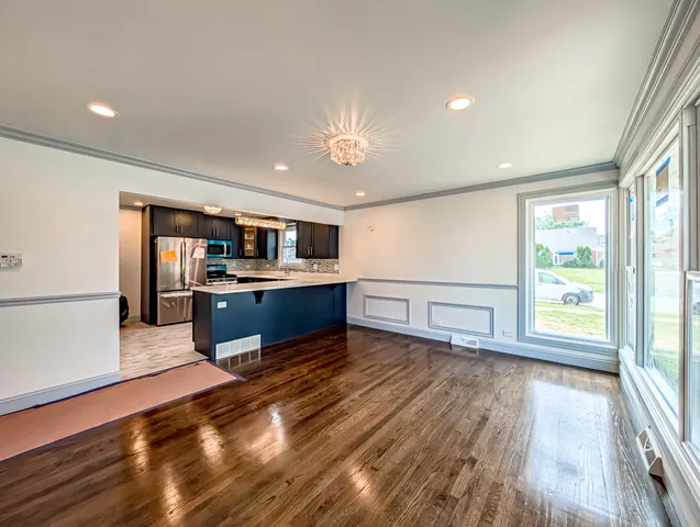 a view of kitchen with wooden floor