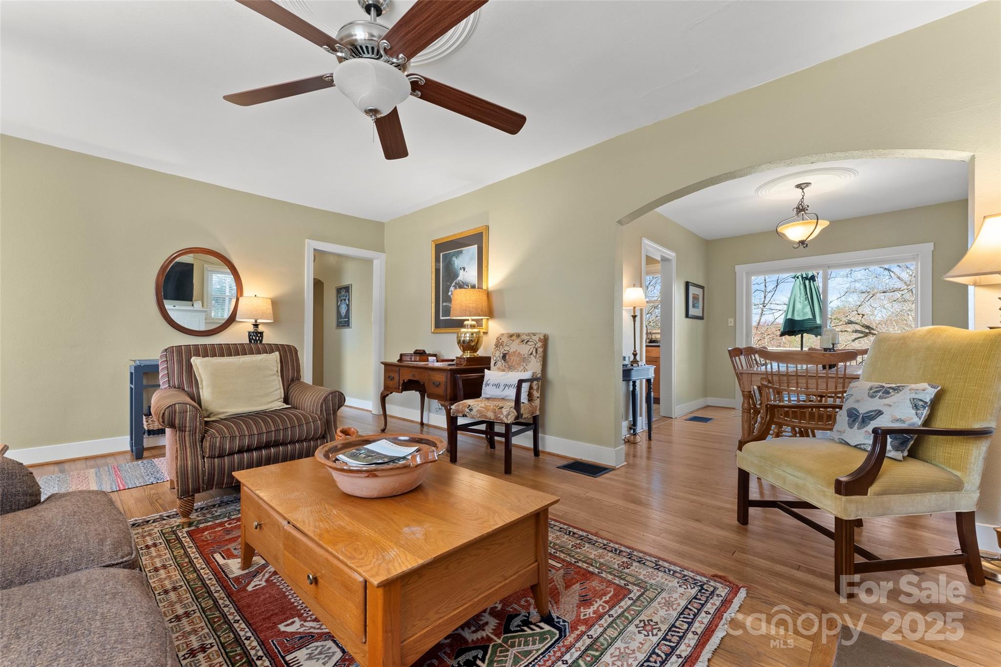 580 Maple Street Brevard, NC 28712 - Photo 13 of 28 a living room with furniture and a clock