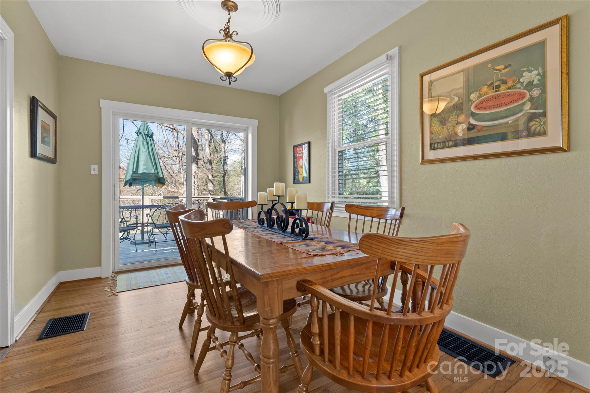 580 Maple Street Brevard, NC 28712 - Photo 14 of 28 a view of a dining room with furniture window and wooden floor
