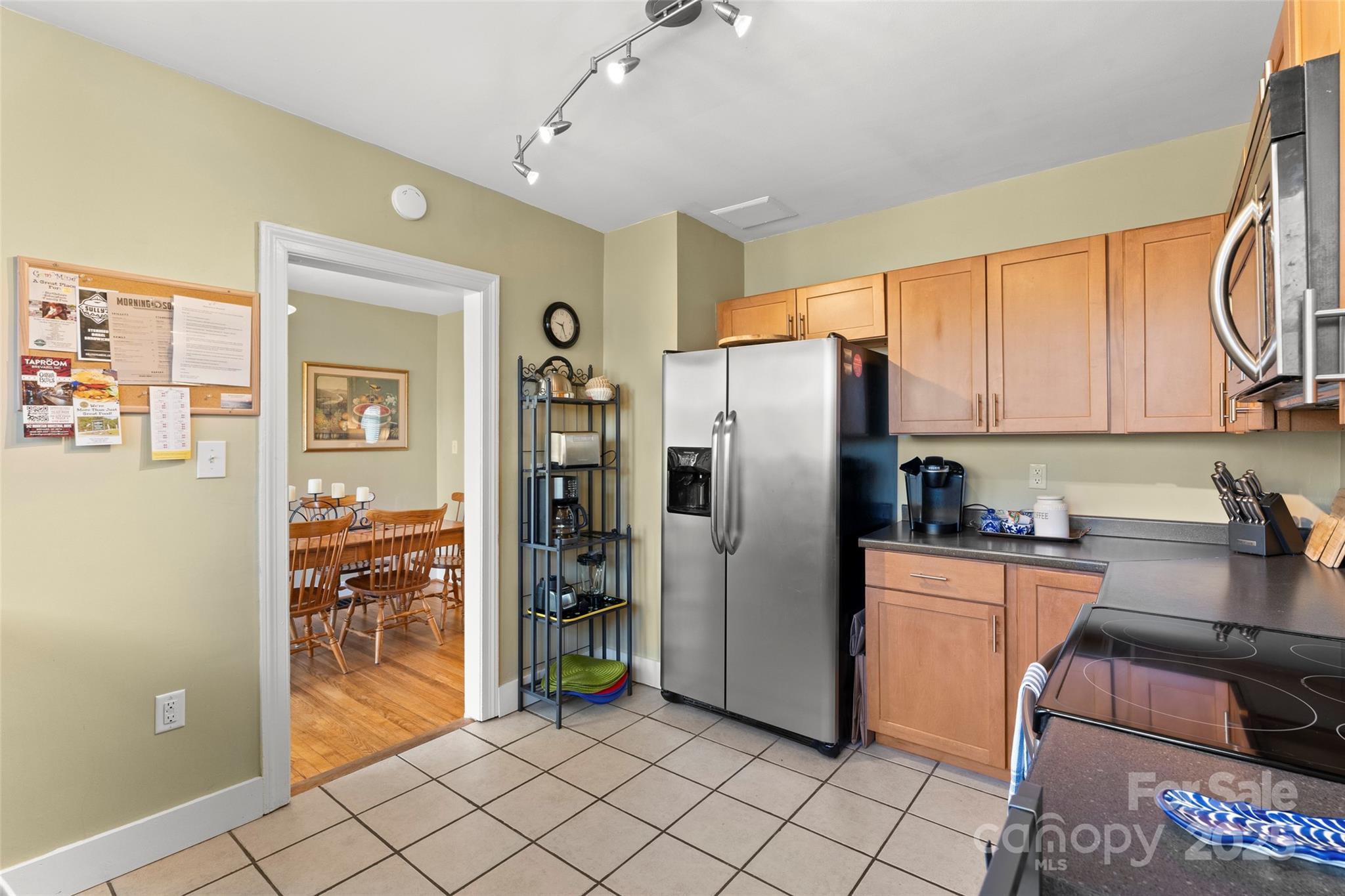 580 Maple Street Brevard, NC 28712 - Photo 17 of 28 a kitchen with stainless steel appliances granite countertop a refrigerator and a stove top oven