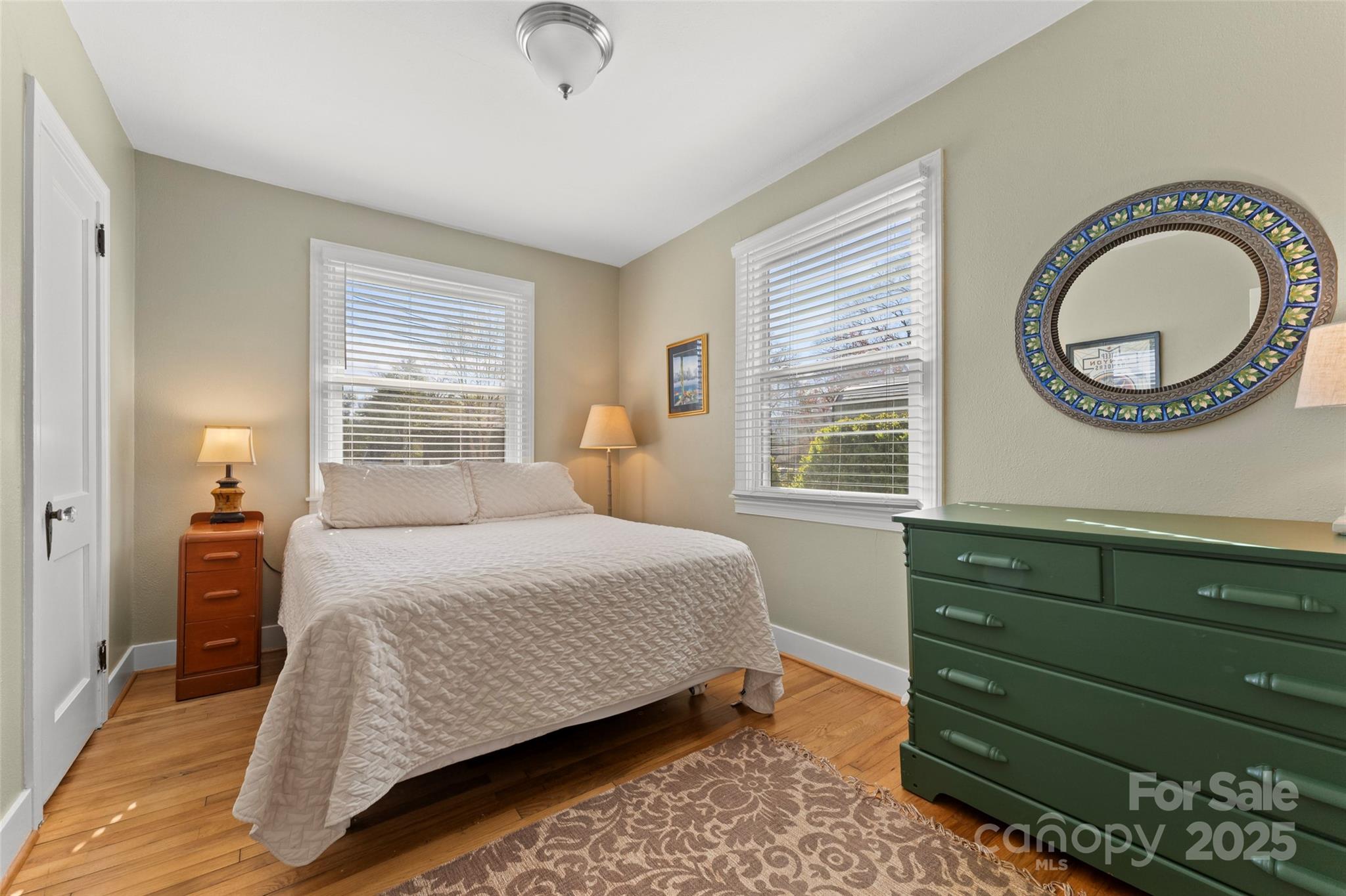 580 Maple Street Brevard, NC 28712 - Photo 23 of 28 a bedroom with a bed and a dresser