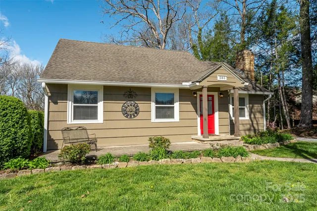 a view of a city with lots of residential buildings and mountain view in back
