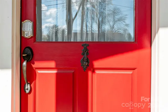 a bathroom with a shower and a mirror