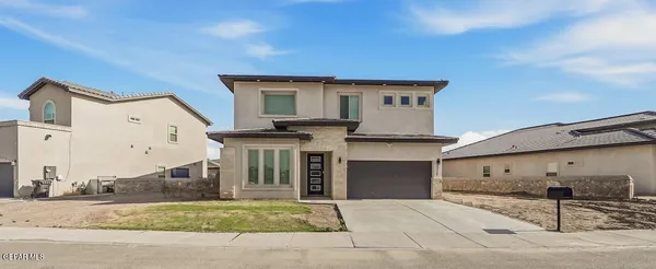 a kitchen with stainless steel appliances granite countertop a sink a stove and a wooden floors