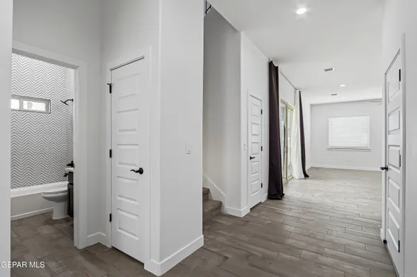 a large kitchen with stainless steel appliances kitchen island granite countertop a stove a sink and a refrigerator