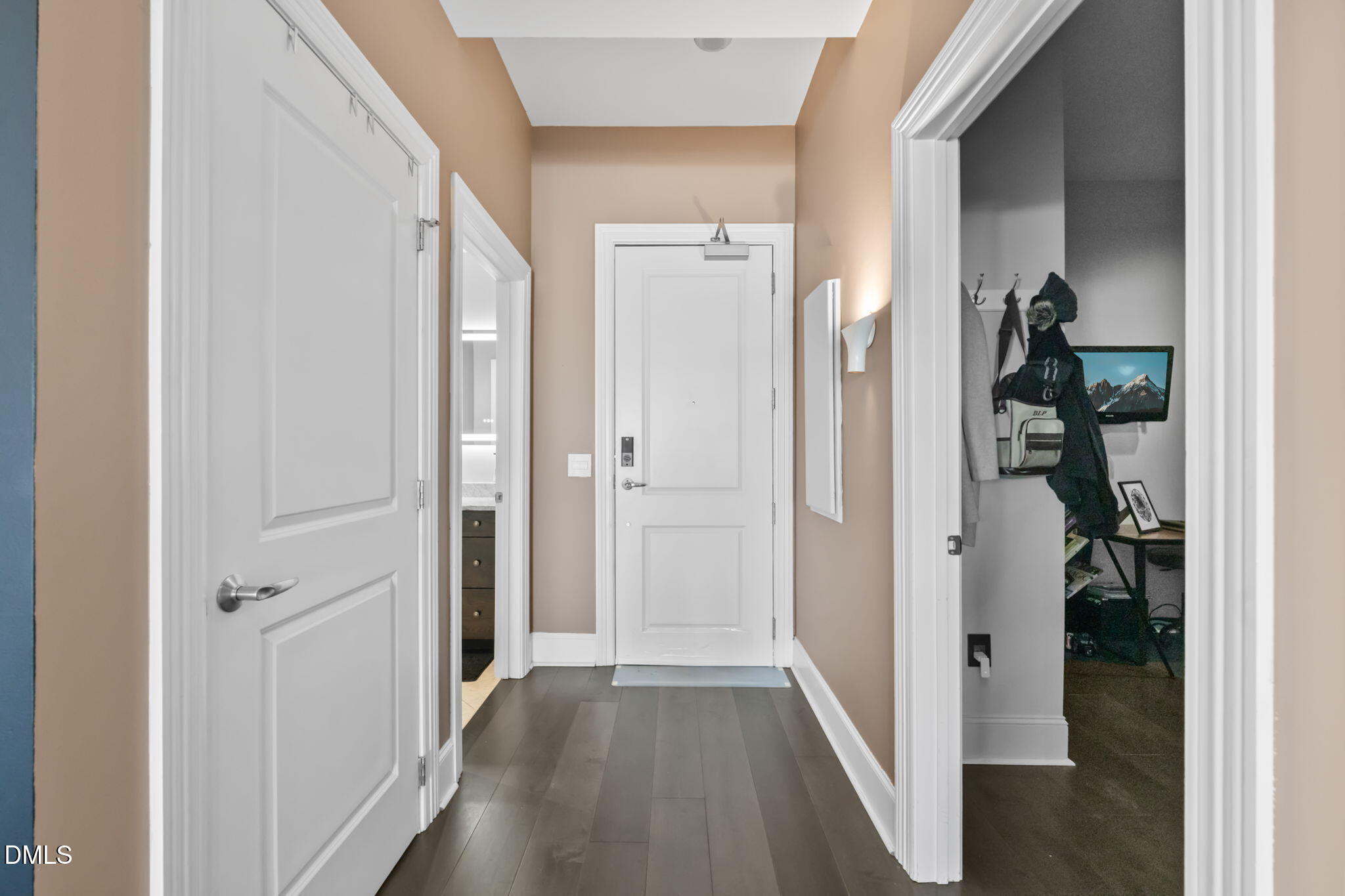 400 West North Street, Unit 1218 Raleigh, NC 27603 - Photo 4 of 41 a view of a hallway with wooden floor and closet