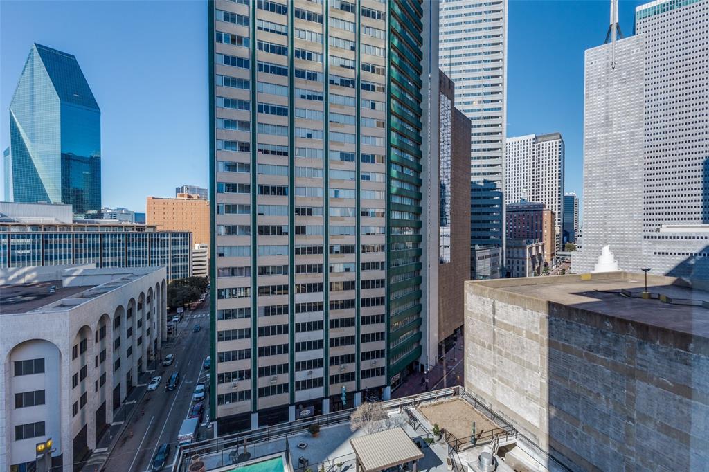 1505 Elm Street, Unit 1004 Dallas, TX 75201 - Photo 27 of 32 a bathroom with a sink and a mirror