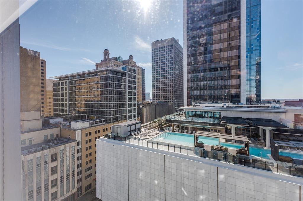 1505 Elm Street, Unit 1004 Dallas, TX 75201 - Photo 29 of 32 a front view of a building with glass windows