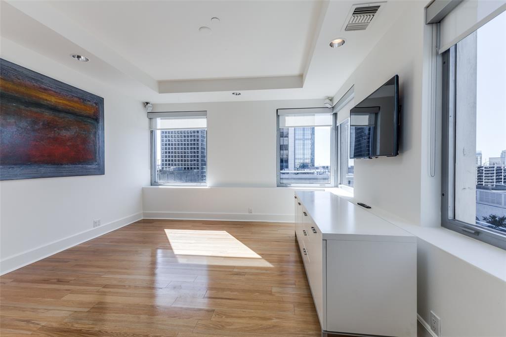 1505 Elm Street, Unit 1004 Dallas, TX 75201 - Photo 10 of 32 a view of a kitchen cabinets and a wooden floor