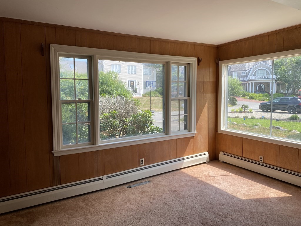 an empty room with an outdoor view and a window