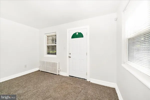 an empty room with a empty space and window