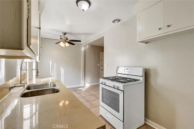 a kitchen with a stove and a sink