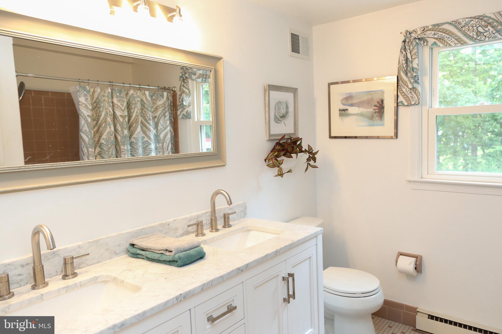 938 Anders Road Lansdale, PA 19446 - Photo 19 of 27 Renovated bath with marble CT and dbl bowl sinks
