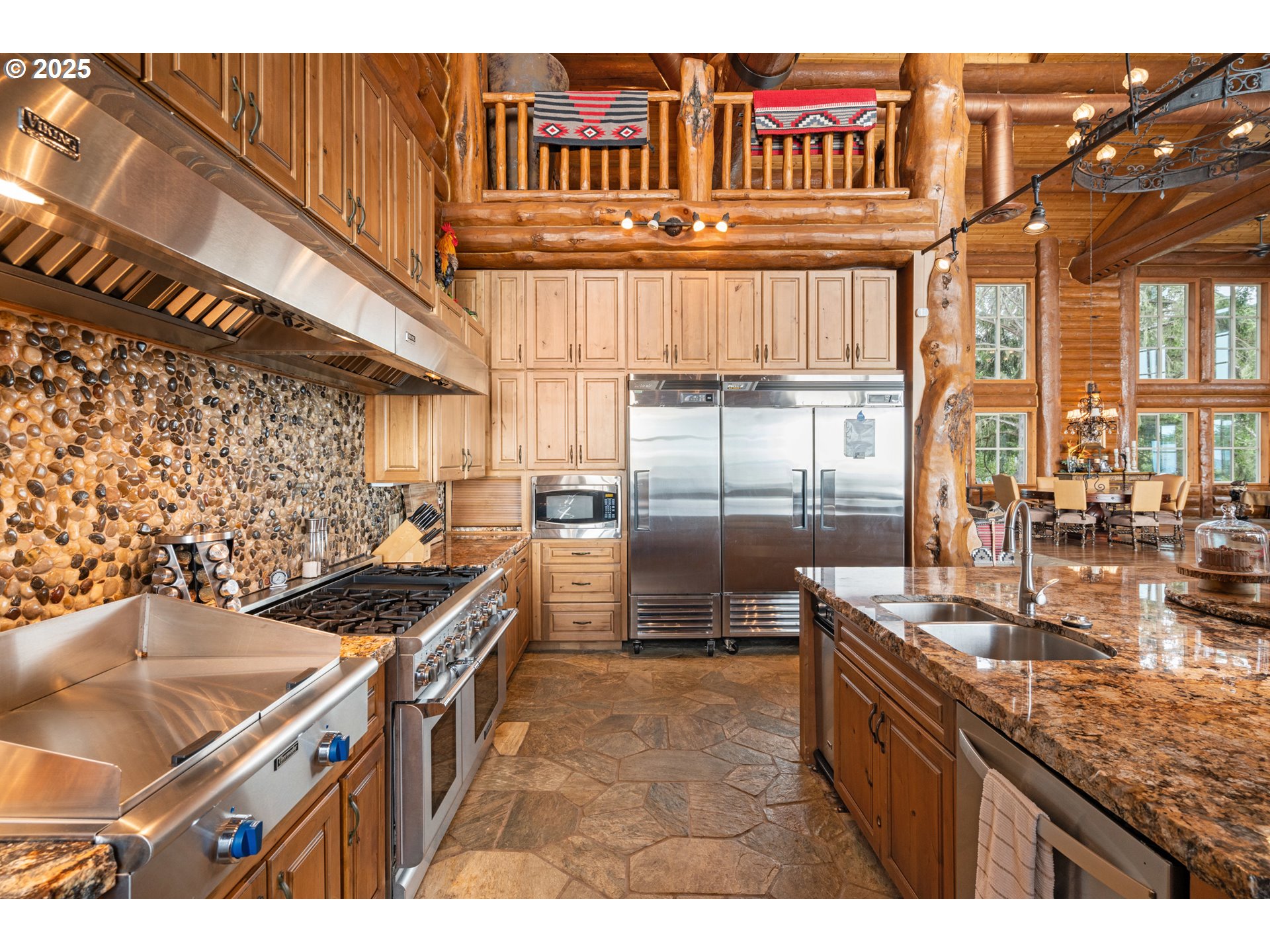 35400 Highway 101 Gold Beach, OR 97444 - Photo 11 of 46 a kitchen with stainless steel appliances granite countertop a stove a sink and a refrigerator