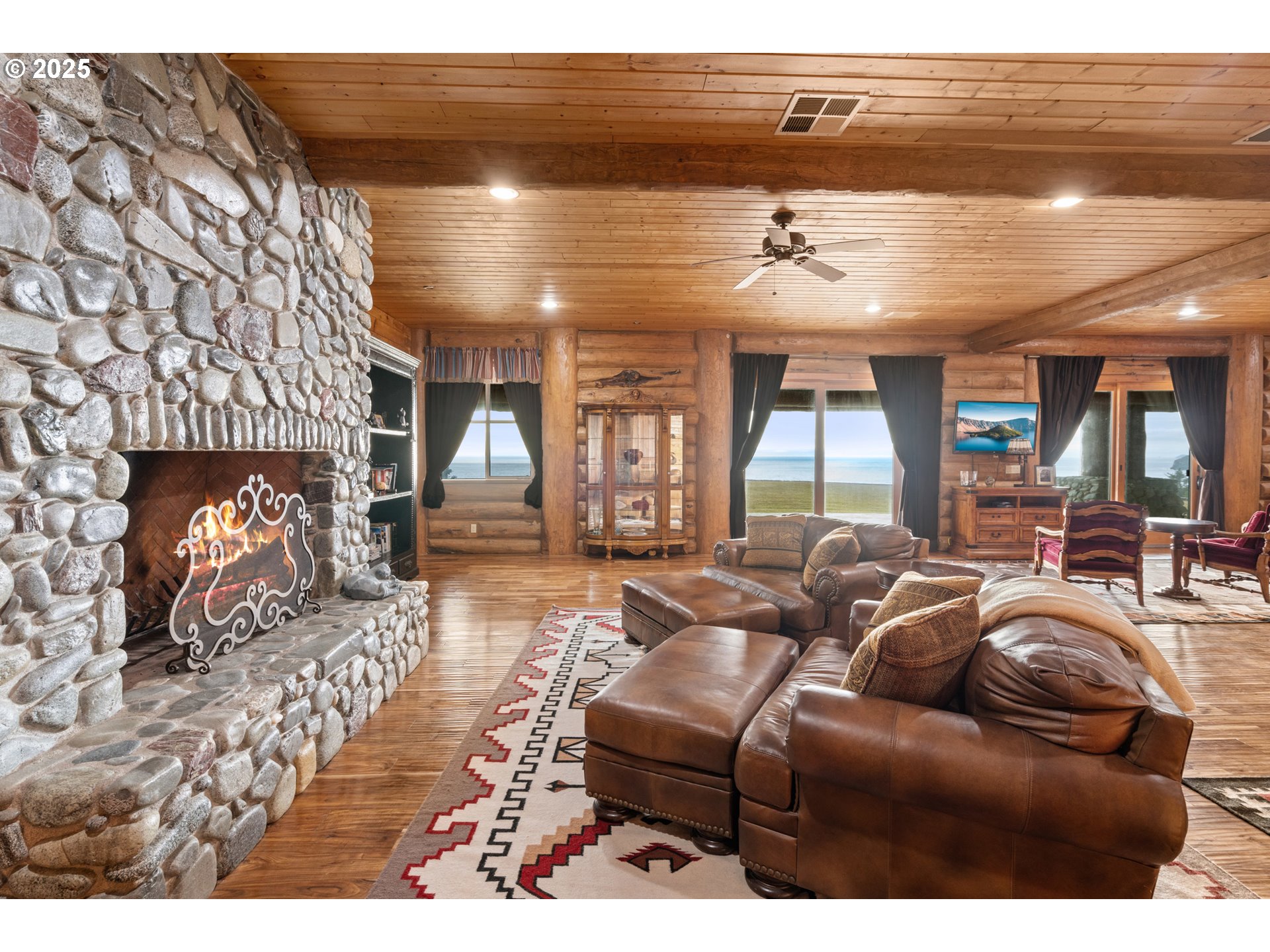 35400 Highway 101 Gold Beach, OR 97444 - Photo 12 of 46 a living room with furniture and a fireplace