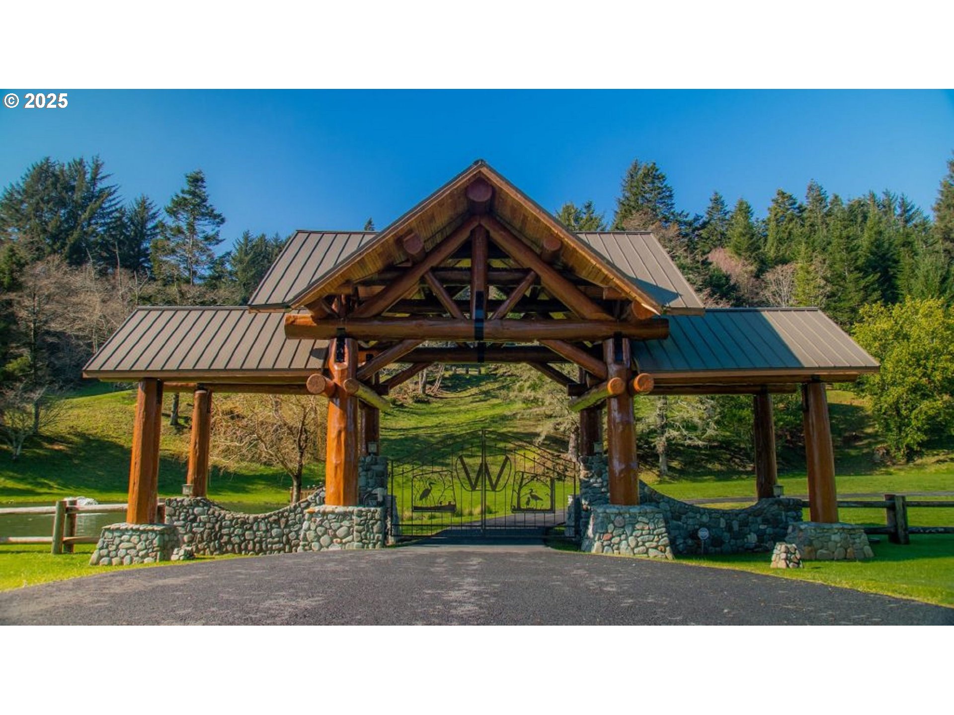 35400 Highway 101 Gold Beach, OR 97444 - Photo 46 of 46 a view of a house with a yard potted plants and a bench