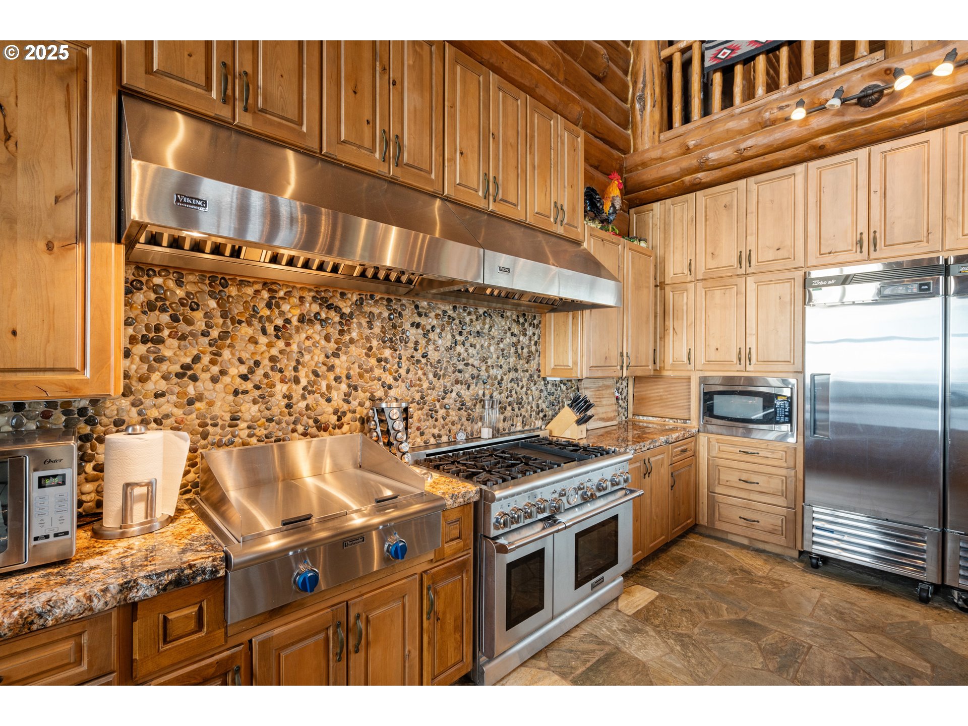 35400 Highway 101 Gold Beach, OR 97444 - Photo 10 of 46 a kitchen with a stove and a refrigerator