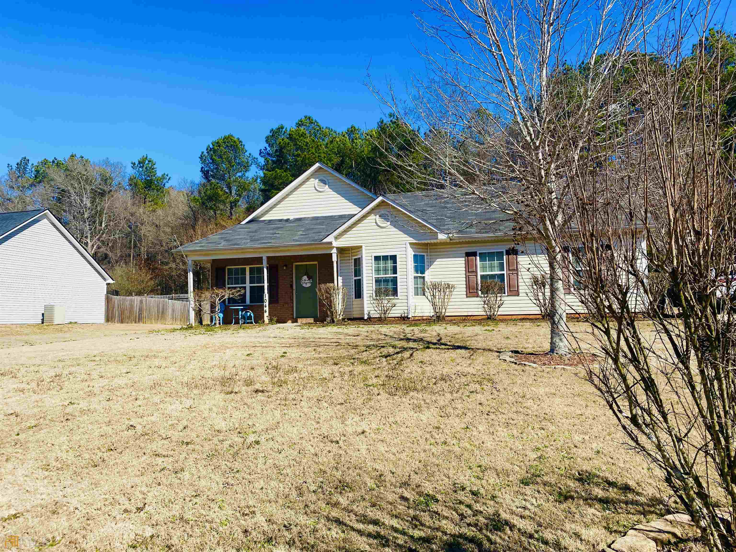 1044 Navaho Trail Monroe, GA 30655 - Photo 1 of 1 a front view of a house with a garden
