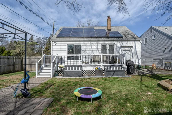 a view of a house with backyard porch and sitting area