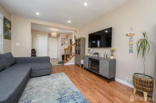 a living room with furniture and a flat screen tv