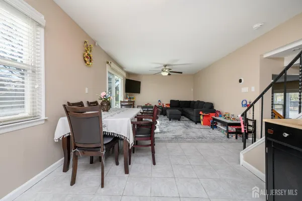 a view of a dining area with furniture and a window
