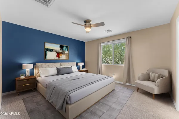 a bedroom with a bed and a couch