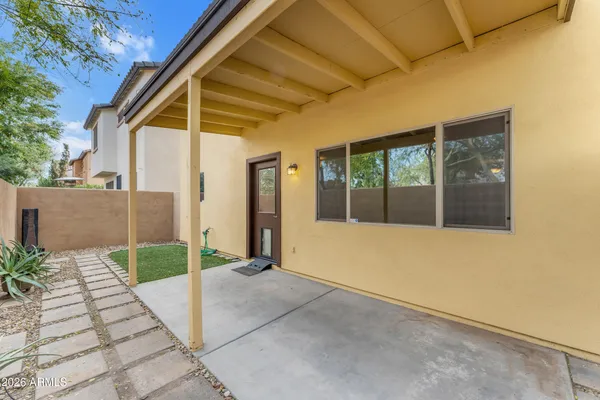 a view of backyard with large windows