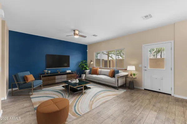 a living room with furniture and a flat screen tv