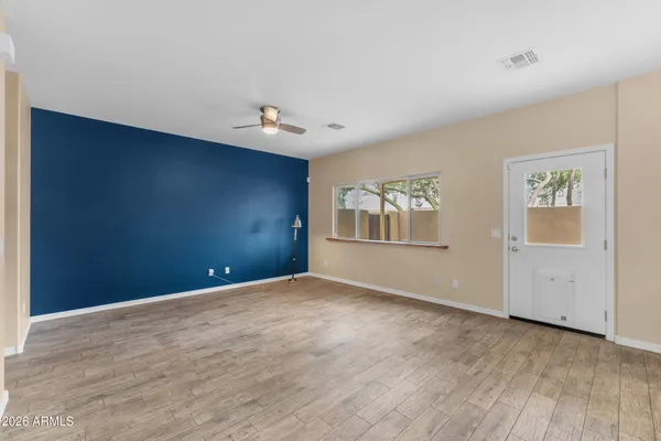 a view of an empty room with a window