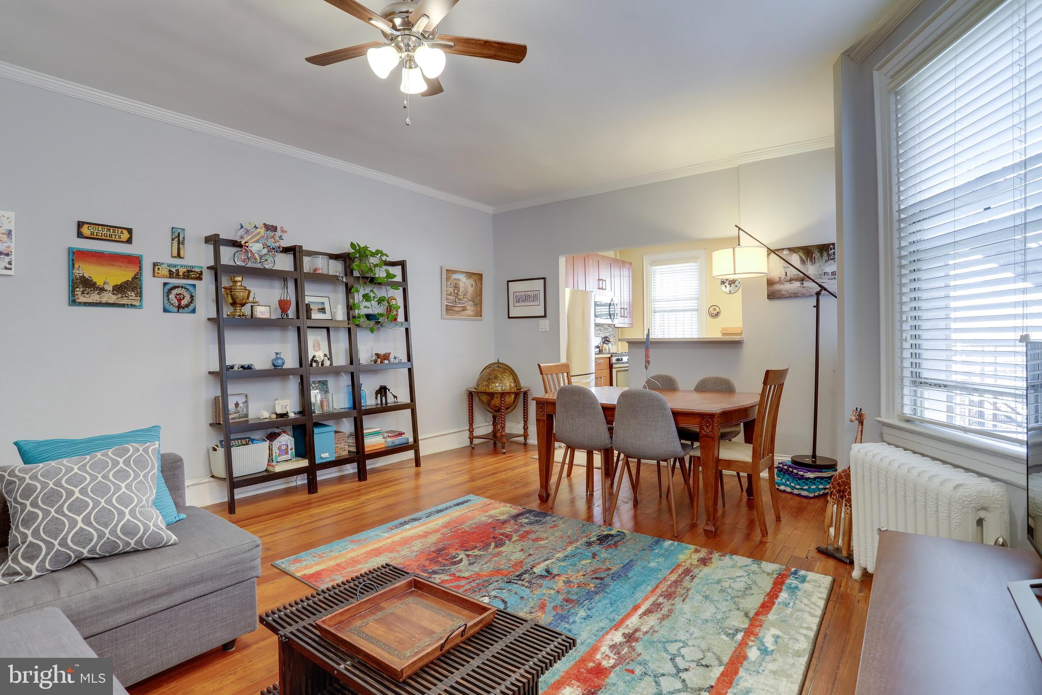 1519 Park Road Northwest, Unit 203 Washington, DC 20010 - Photo 50 of 63 a living room with furniture and wooden floor