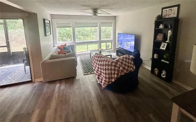a living room with furniture and a large window