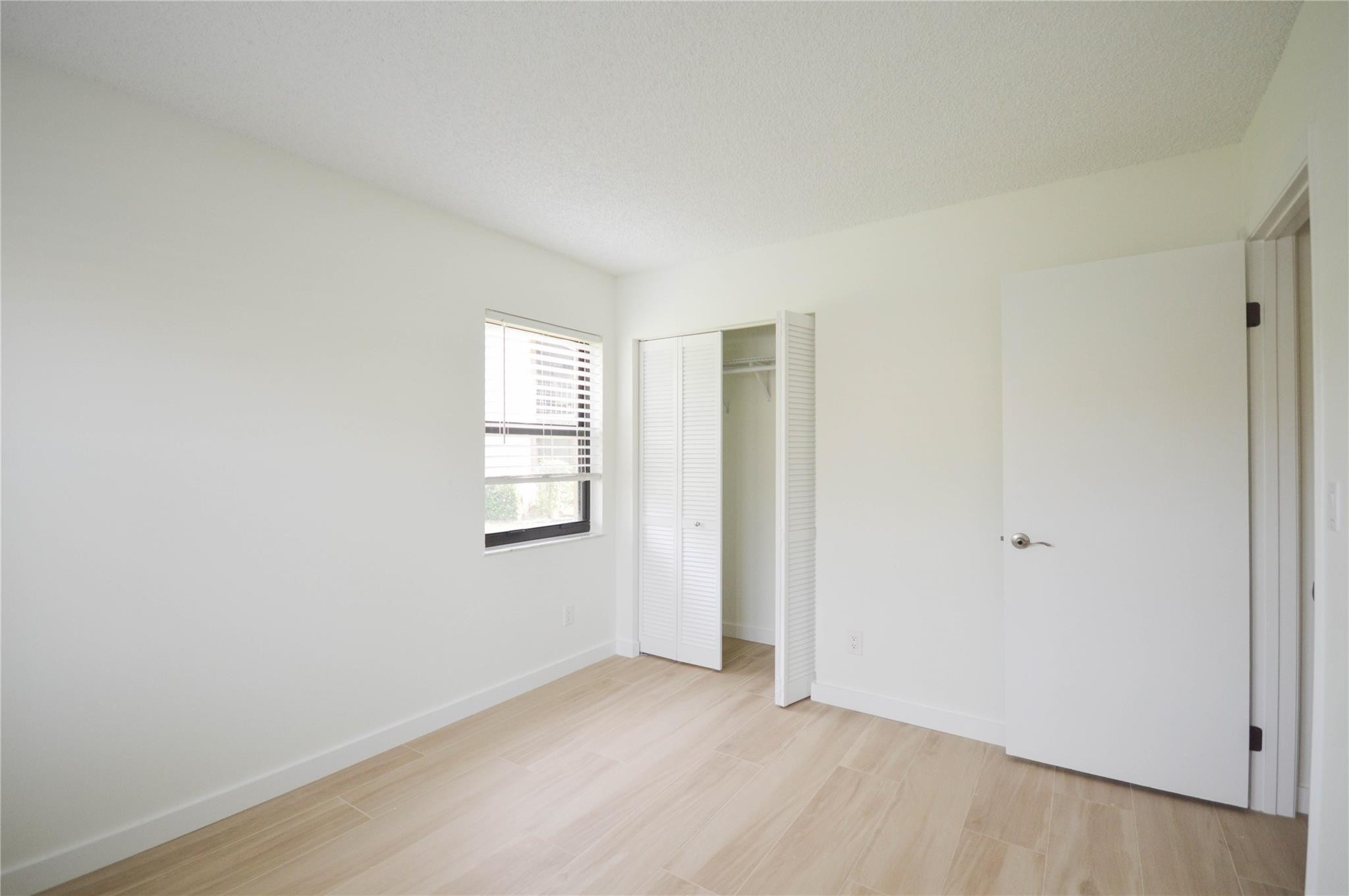 3151 Southeast Aster Lane, Unit 1301 Stuart, FL 34994 - Photo 17 of 30 an empty room with windows