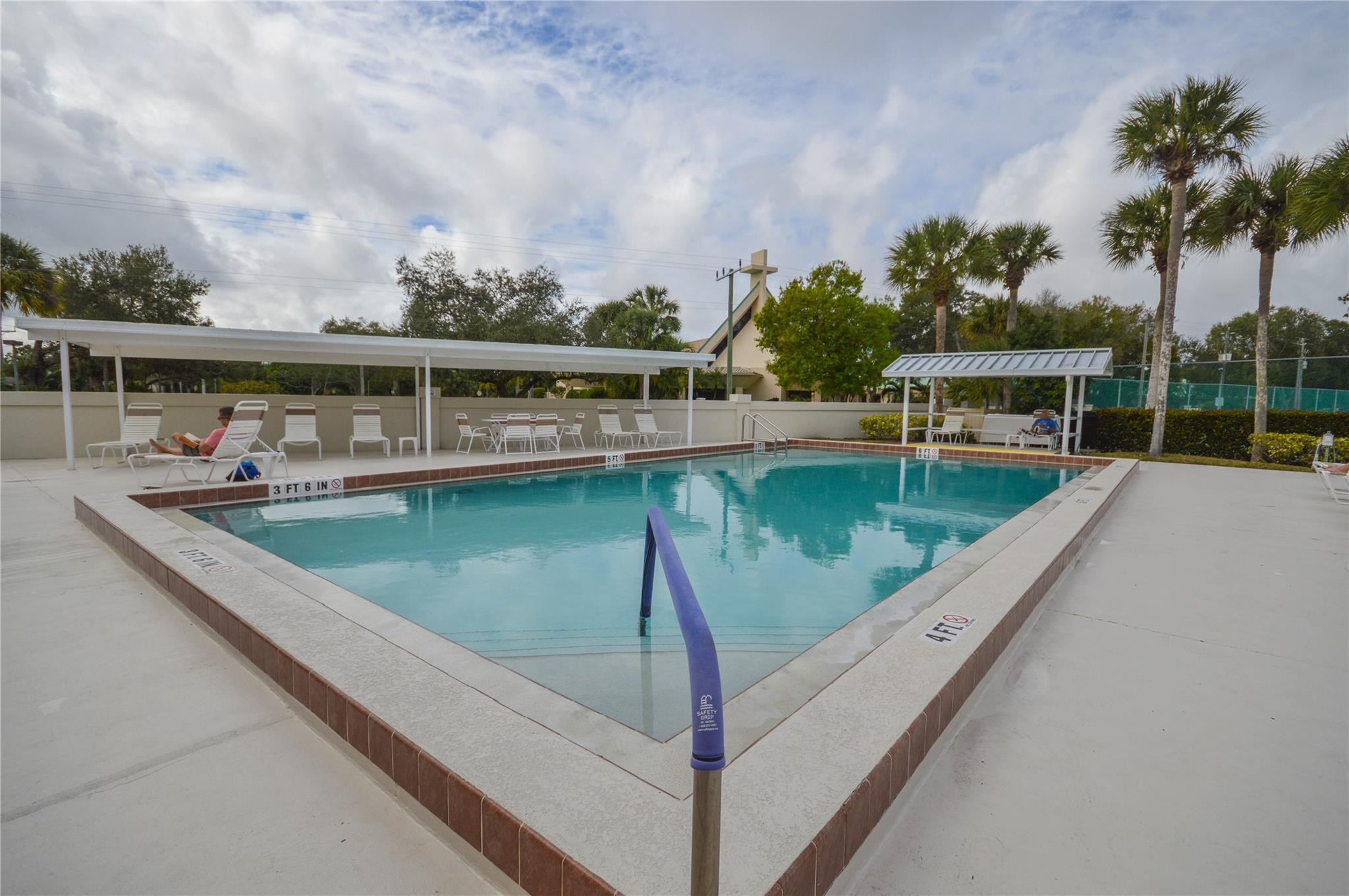3151 Southeast Aster Lane, Unit 1301 Stuart, FL 34994 - Photo 28 of 30 a view of a swimming pool with a patio