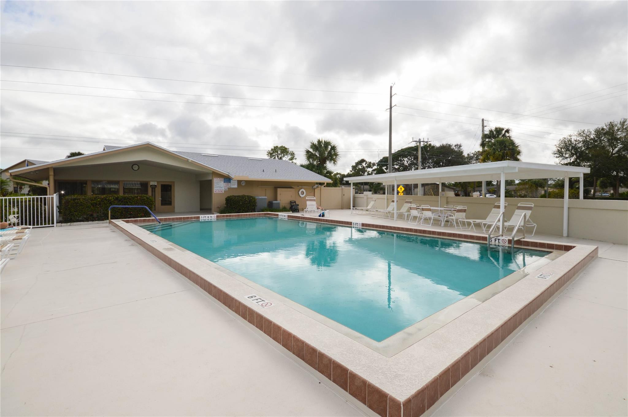 3151 Southeast Aster Lane, Unit 1301 Stuart, FL 34994 - Photo 29 of 30 a view of a house with pool