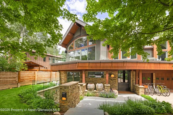 a view of a two chairs and table in the balcony