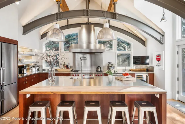 a dining table with chairs and window